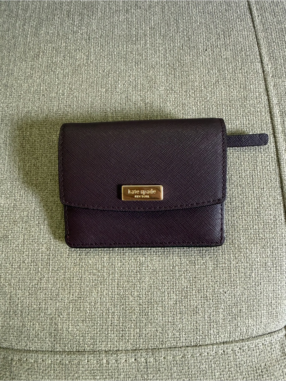 kate spade black saffiano leather bi-fold wallet with gold plaque